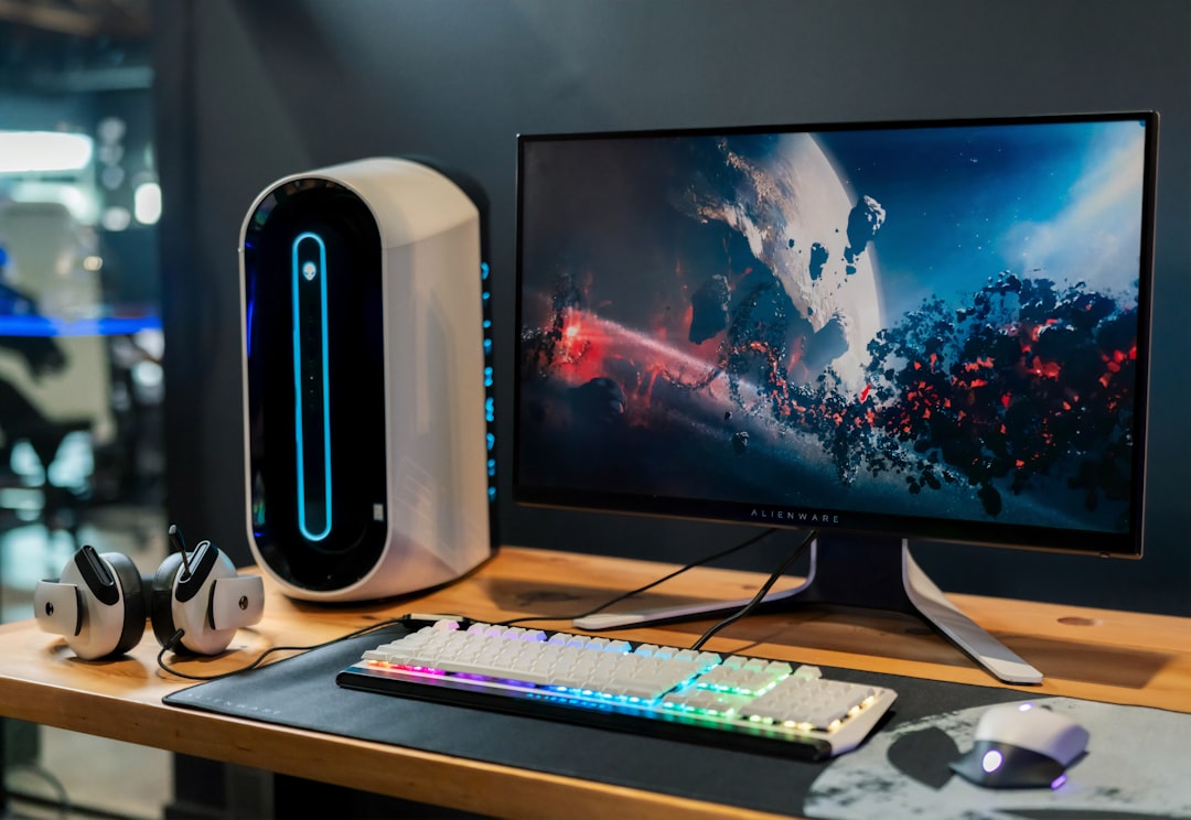 black-flat-screen-computer-monitor-beside-white-computer-keyboard-hpaq-kbcyhk