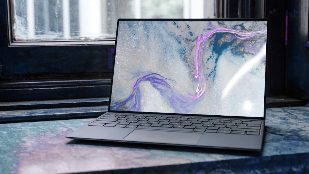 product-04 laptop-with-abstract-pattern-on-marble-ynvvnpcurd8